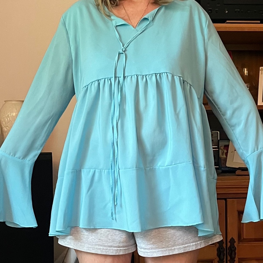 Size L Baby blue bell sleeve ruffle hem tunic top